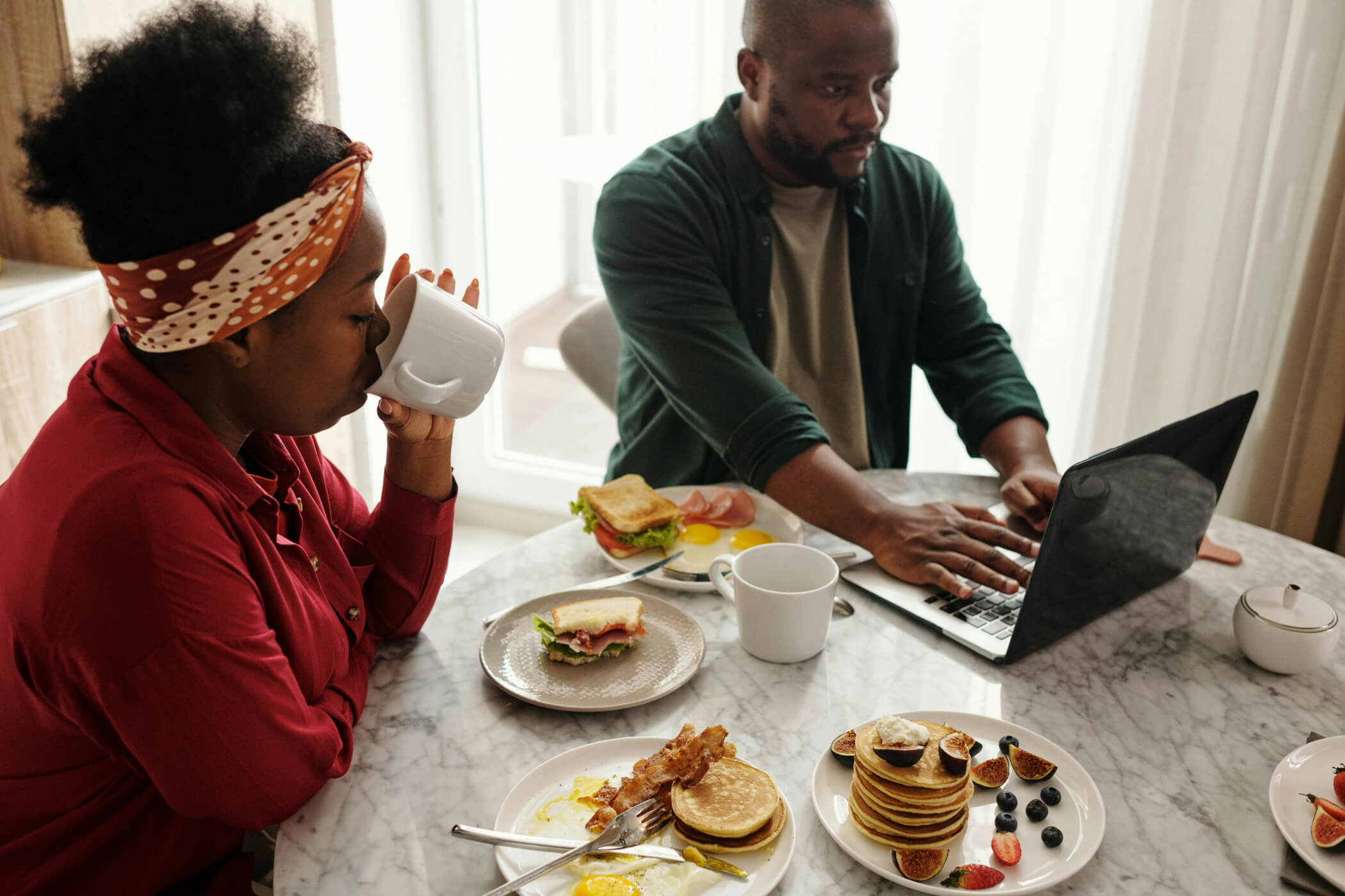 African couple having breakfast together